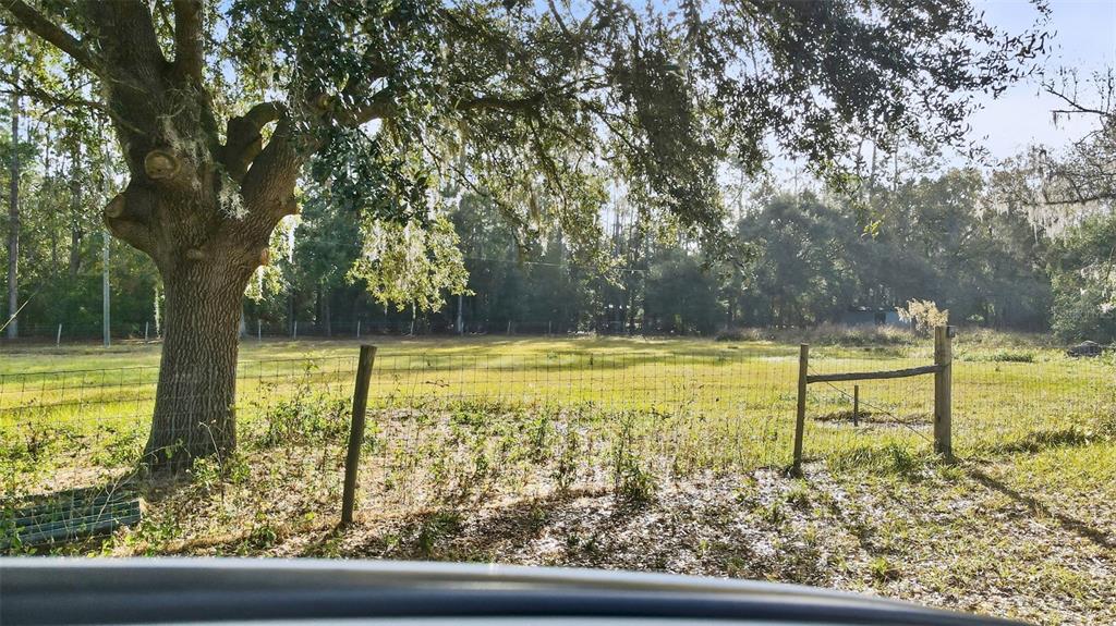 7275 Knowles Road Polk City, FL 33868 - Photo 29 of 39 a view of swimming pool from a window