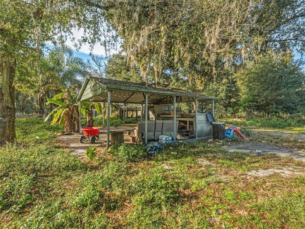 7275 Knowles Road Polk City, FL 33868 - Photo 3 of 39 a view of a house with a yard and sitting area