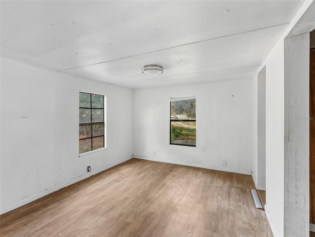 7275 Knowles Road Polk City, FL 33868 - Photo 10 of 39 an empty room with a window