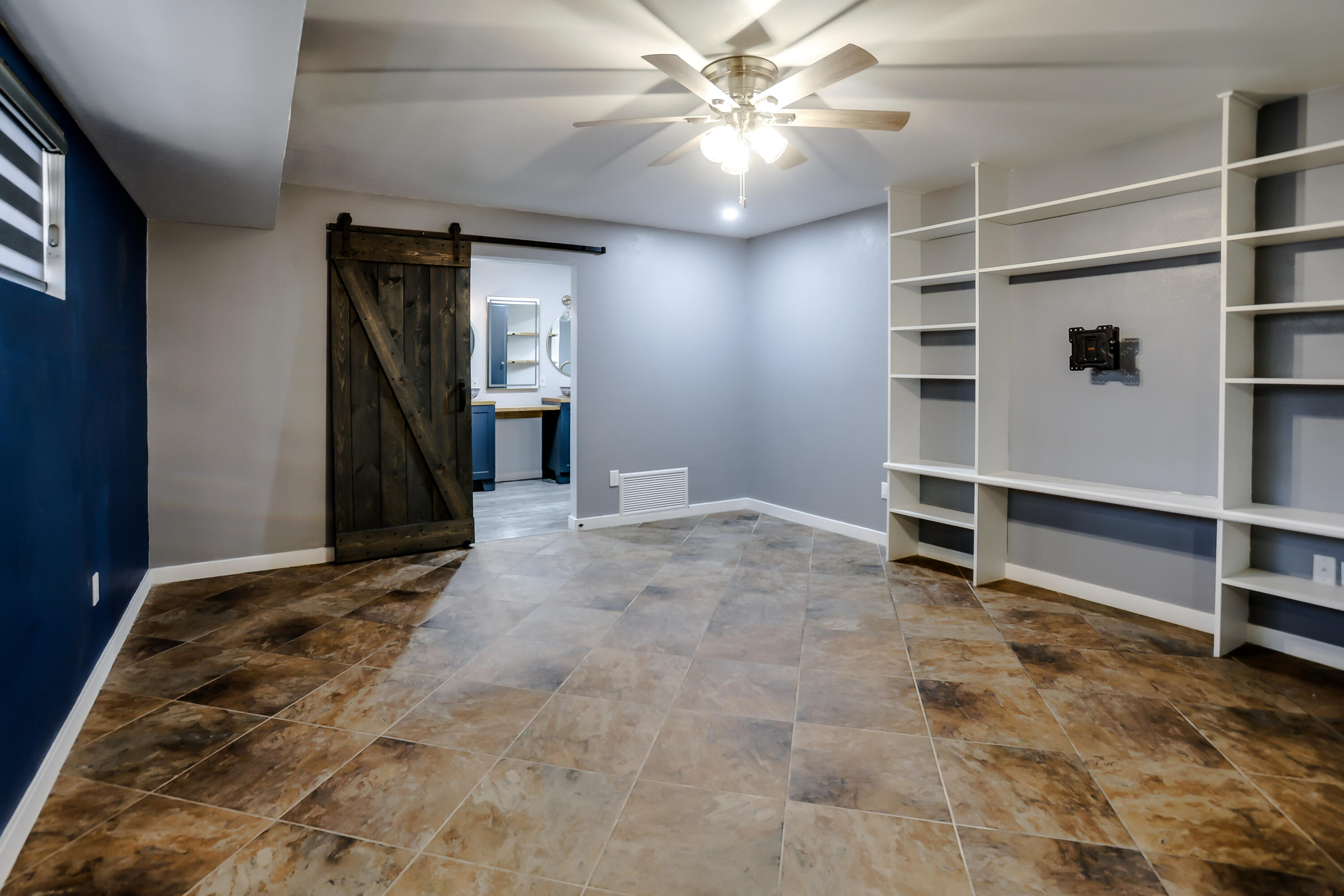 3615 47th Street Lubbock, TX 79413 - Photo 14 of 36 an empty room with closet and a ceiling fan