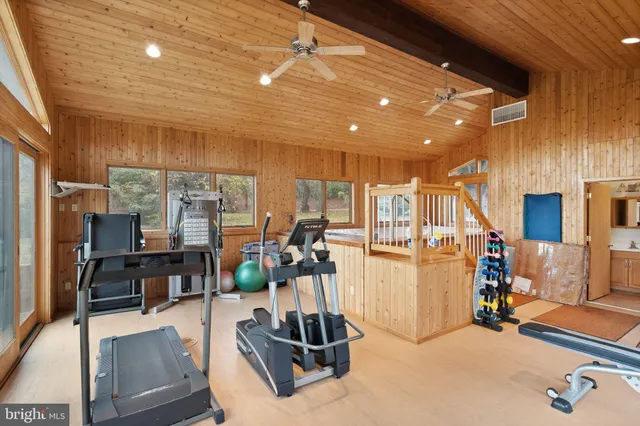 a kitchen with stainless steel appliances granite countertop sink stove and wooden cabinets