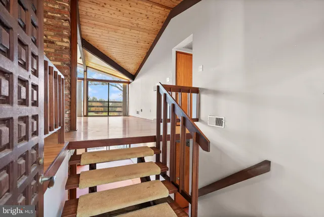 a view of an empty room with a balcony