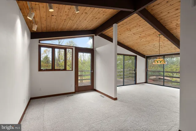 a bathroom with a toilet and a bathtub