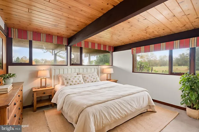 a backyard of a house with barbeque oven table and chairs