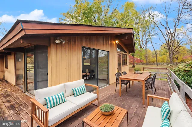 a bathroom with a sink a toilet and a shower curtain