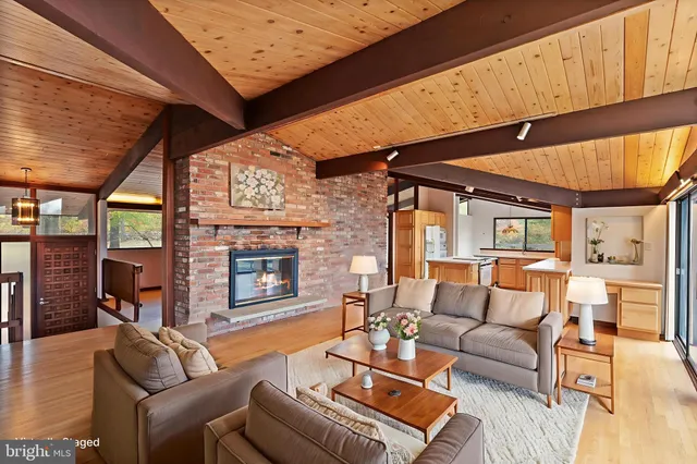 an aerial view of a house with a swimming pool