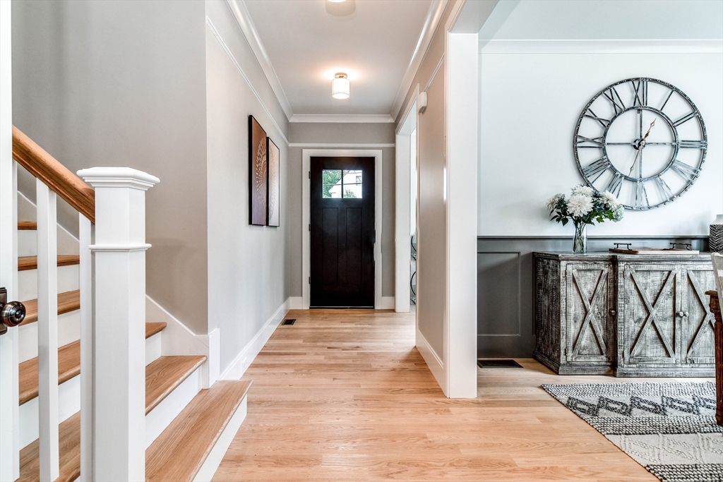 1 Winter Street Natick, MA 01760 - Photo 16 of 26 a view of a hallway with wooden floor and staircase