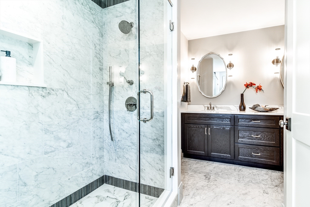 1 Winter Street Natick, MA 01760 - Photo 20 of 26 a bathroom with a sink and a mirror
