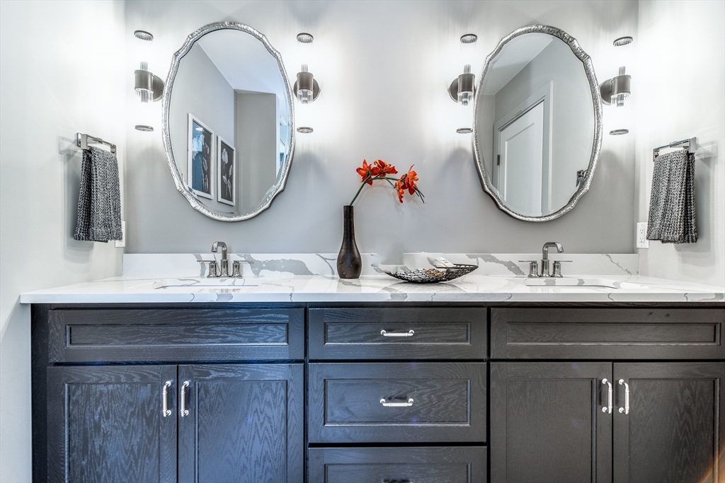 1 Winter Street Natick, MA 01760 - Photo 21 of 26 a bathroom with a double vanity sink and a mirror