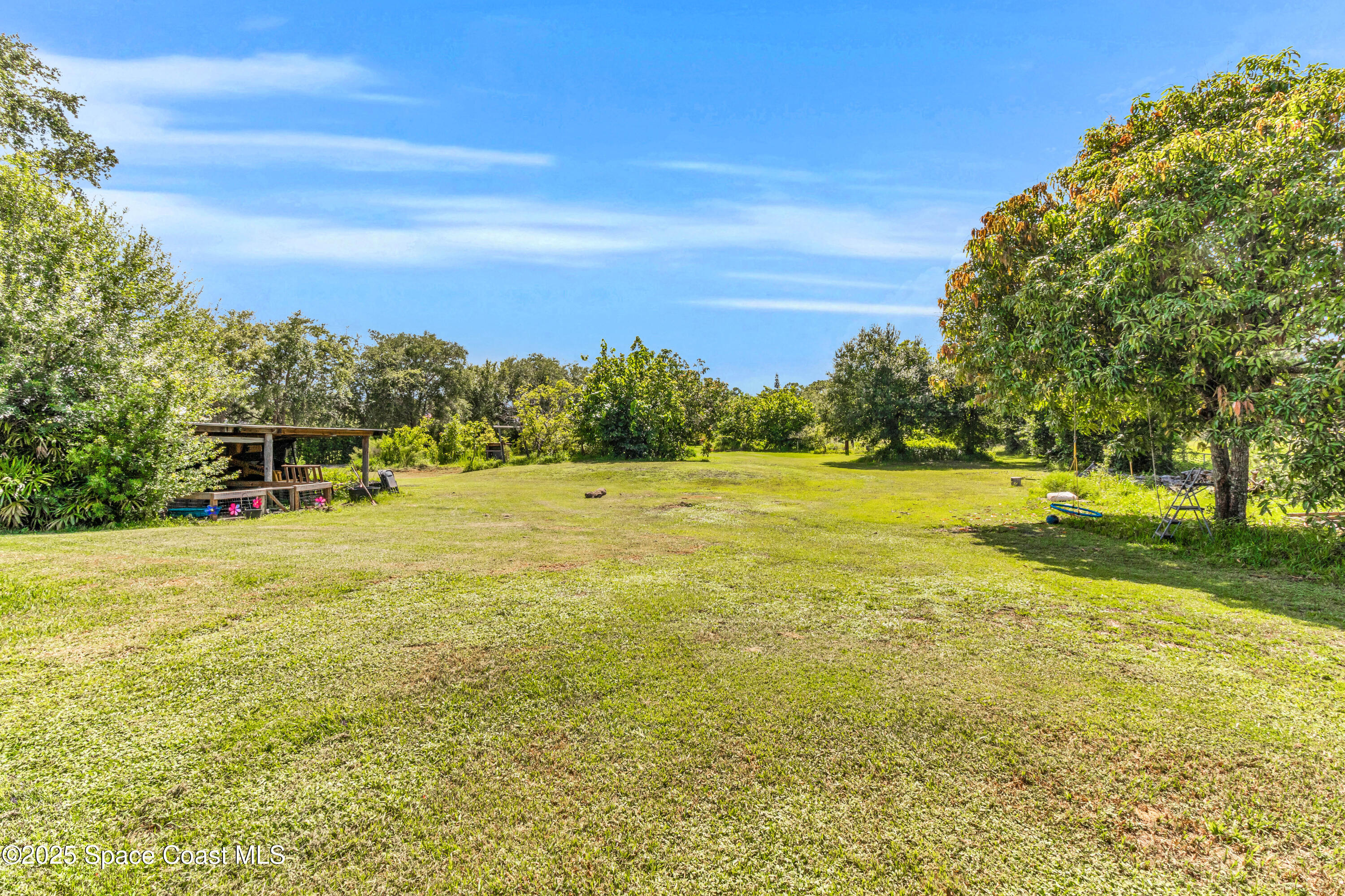 1980 Corey Road Malabar, FL 32950 - Photo 11 of 42 a view of a swimming pool and an outdoor seating
