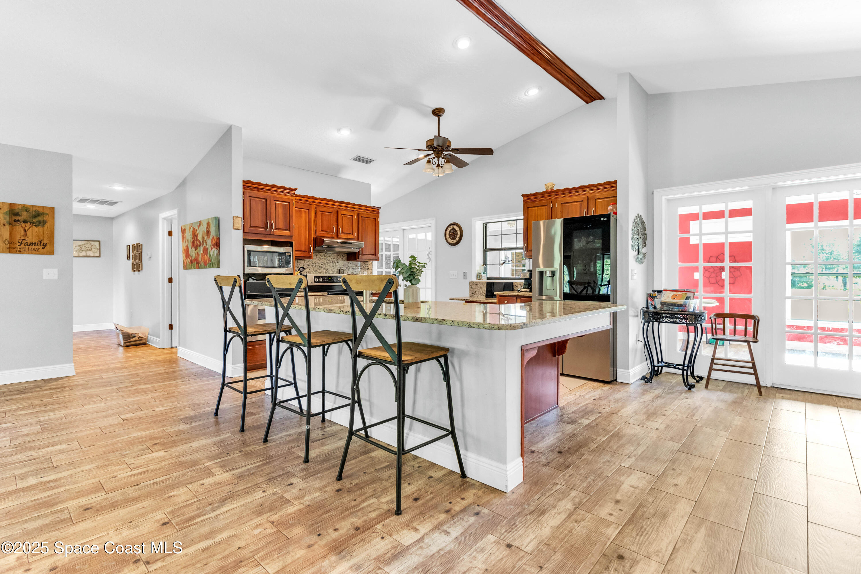 1980 Corey Road Malabar, FL 32950 - Photo 20 of 42 a view of a dining room with furniture and a kitchen