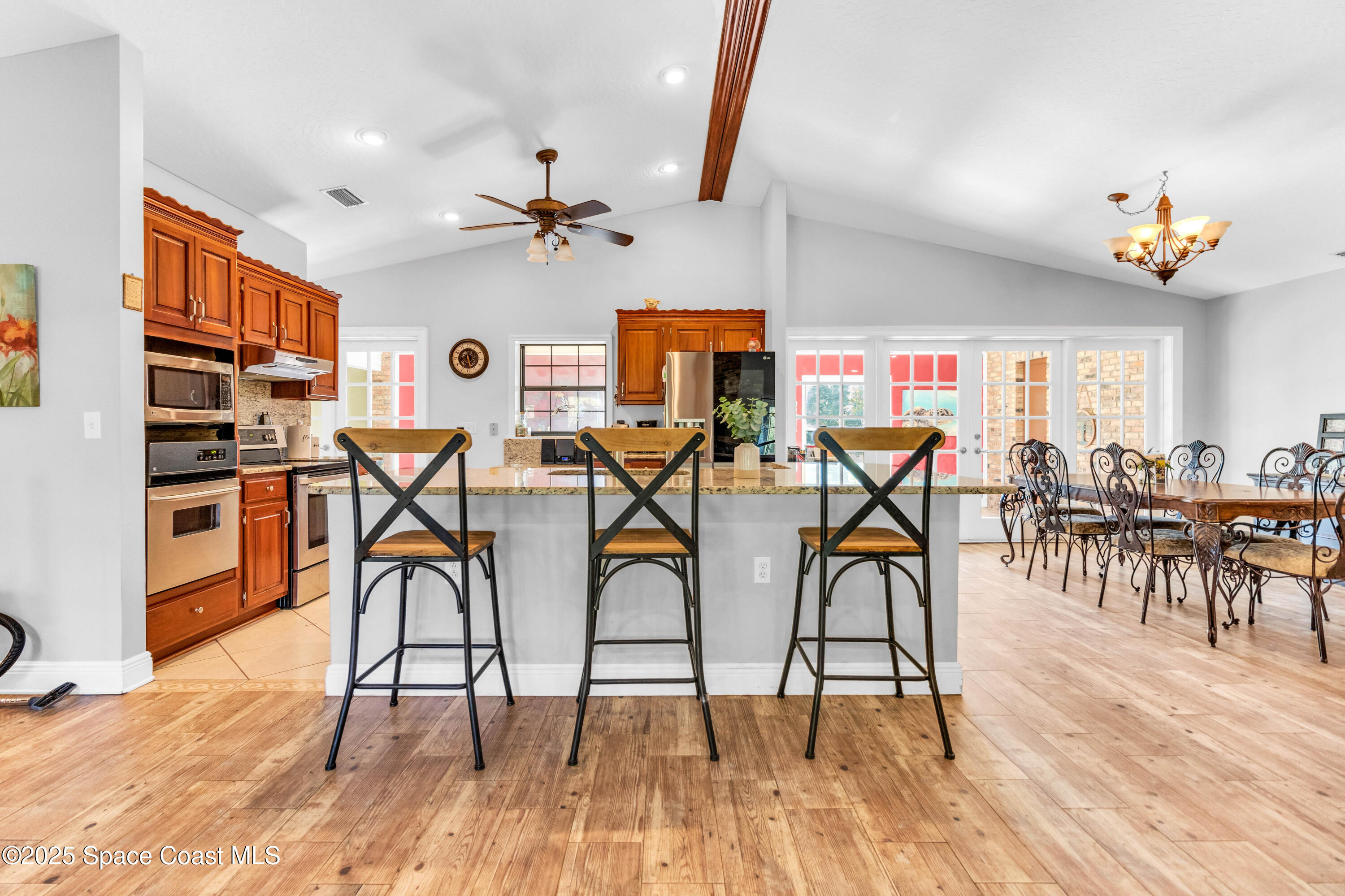 1980 Corey Road Malabar, FL 32950 - Photo 22 of 42 a view of a dining room with furniture and wooden floor