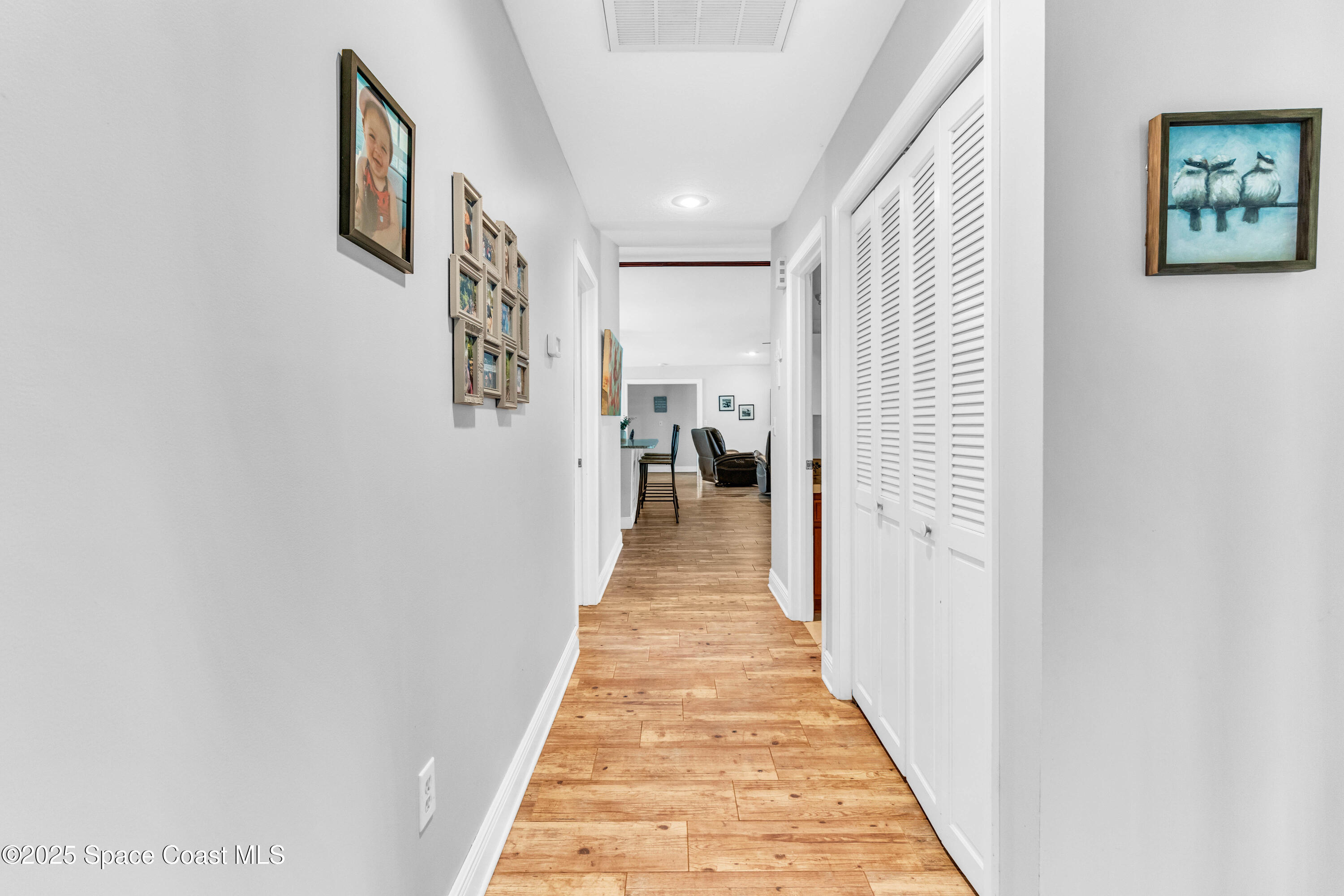 1980 Corey Road Malabar, FL 32950 - Photo 31 of 42 a view of a hallway with wooden floor and stairs