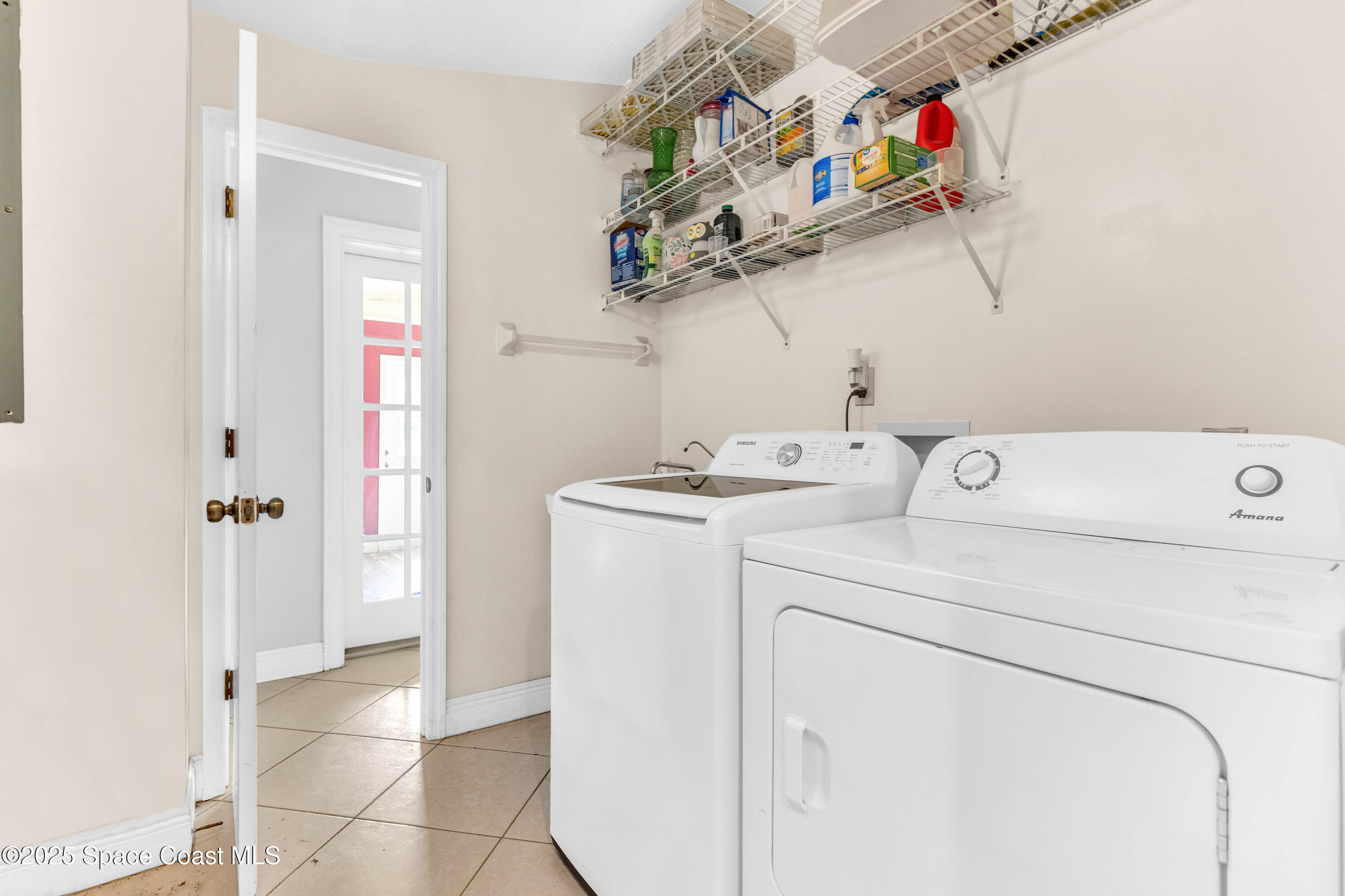 1980 Corey Road Malabar, FL 32950 - Photo 33 of 42 a view of storage and utility room with washer and dryer