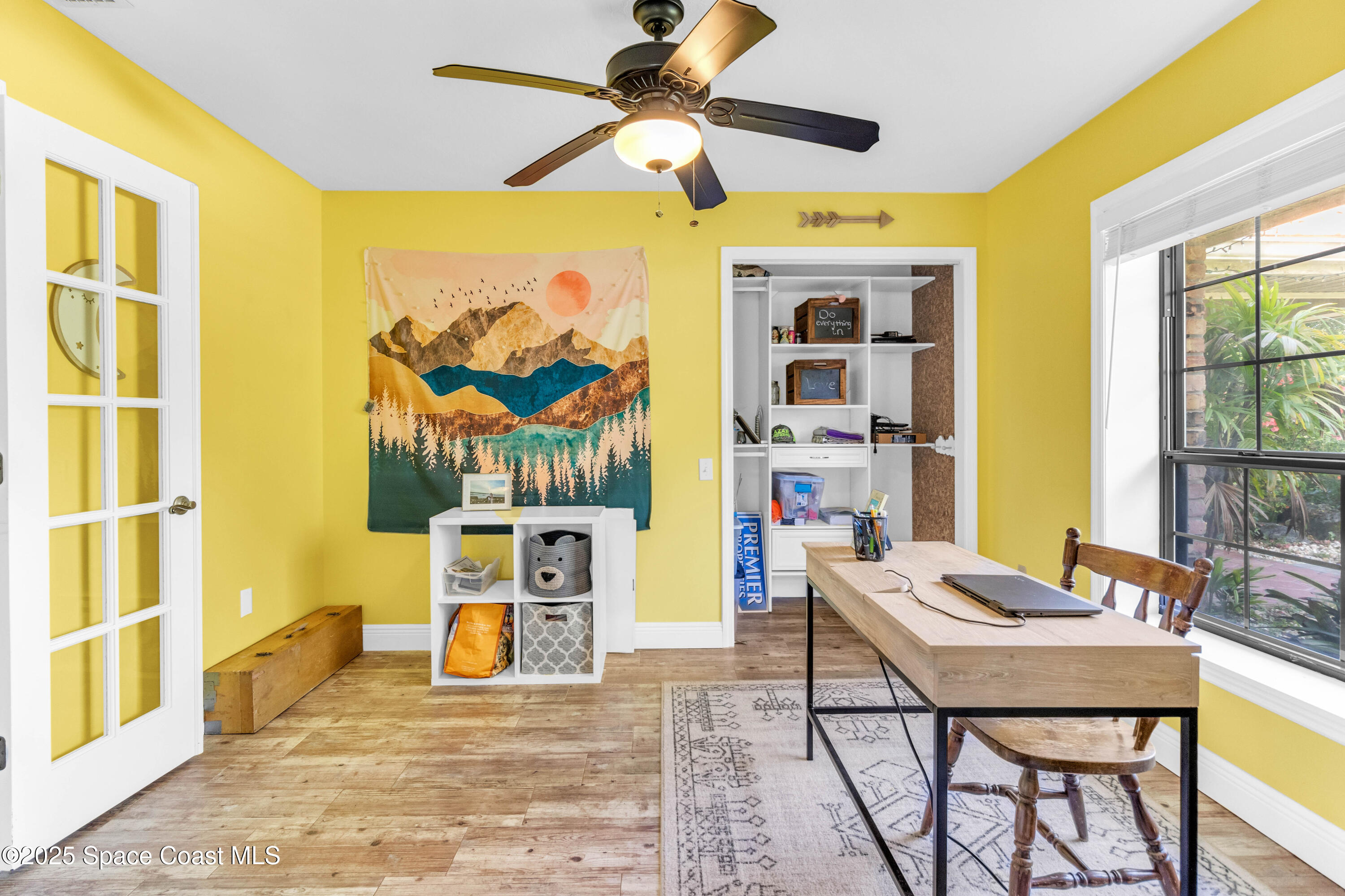 1980 Corey Road Malabar, FL 32950 - Photo 34 of 42 a living room with furniture and a floor to ceiling window