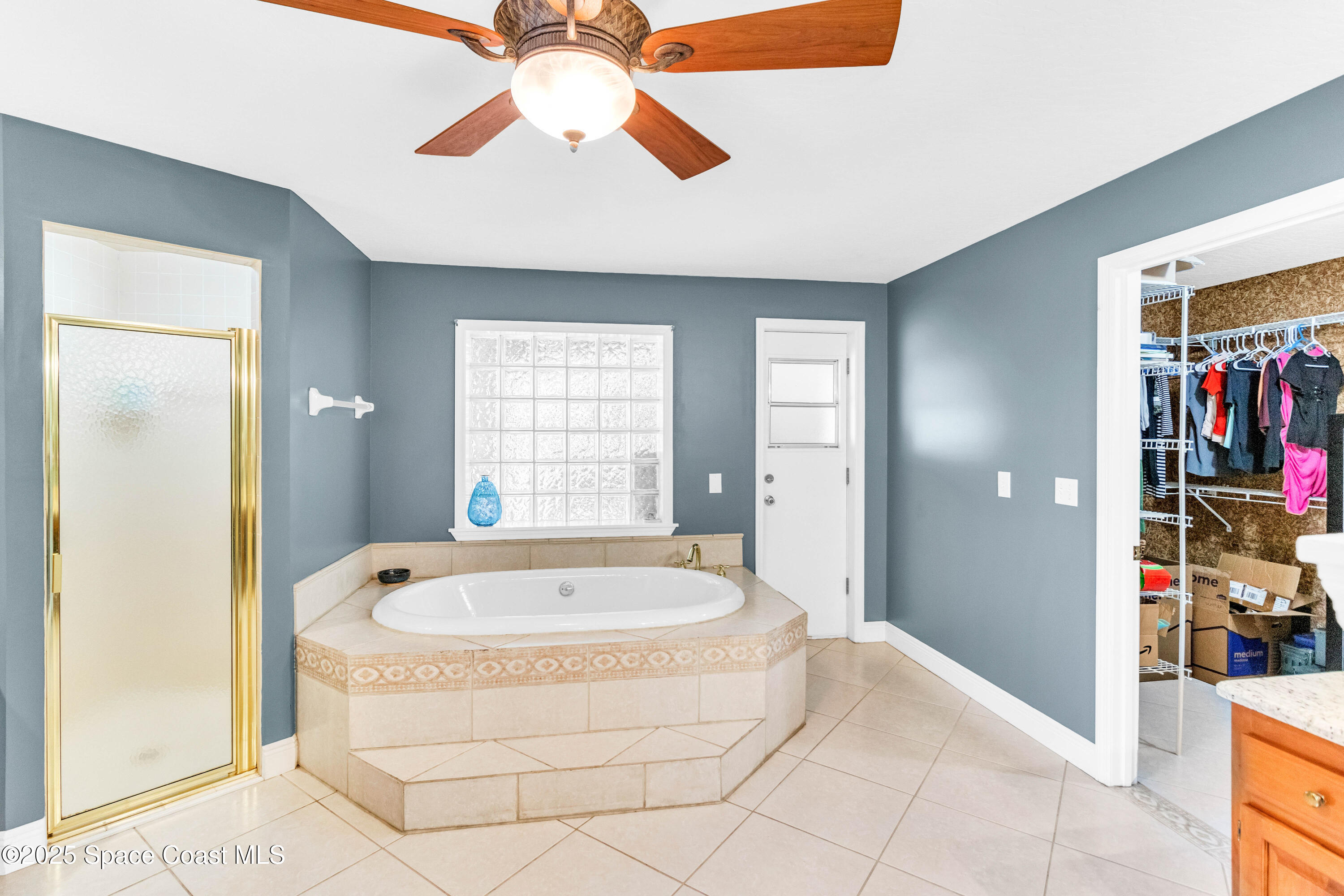 1980 Corey Road Malabar, FL 32950 - Photo 37 of 42 a spacious bathroom with a tub and a shower
