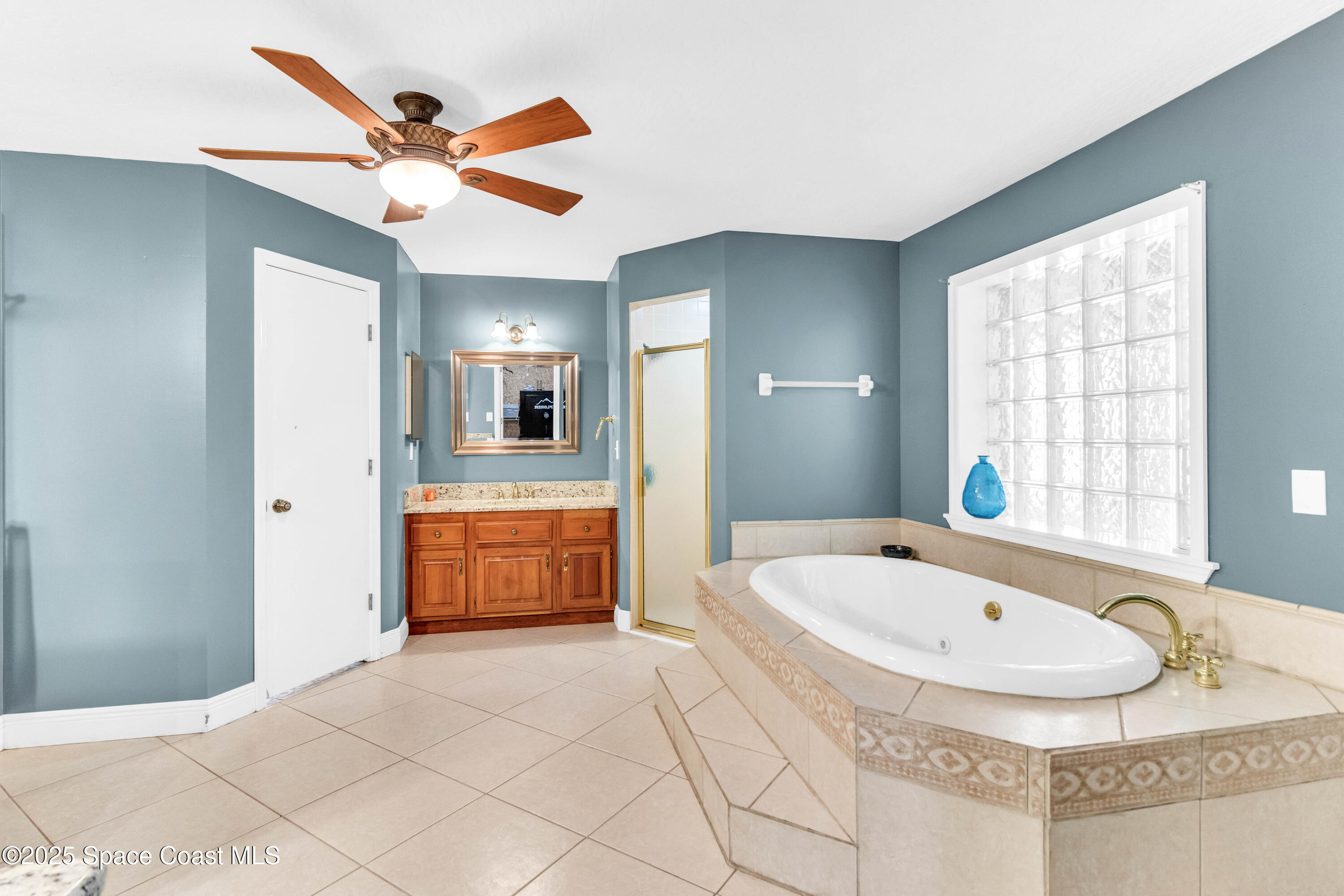 1980 Corey Road Malabar, FL 32950 - Photo 38 of 42 a bathroom with a tub and a sink