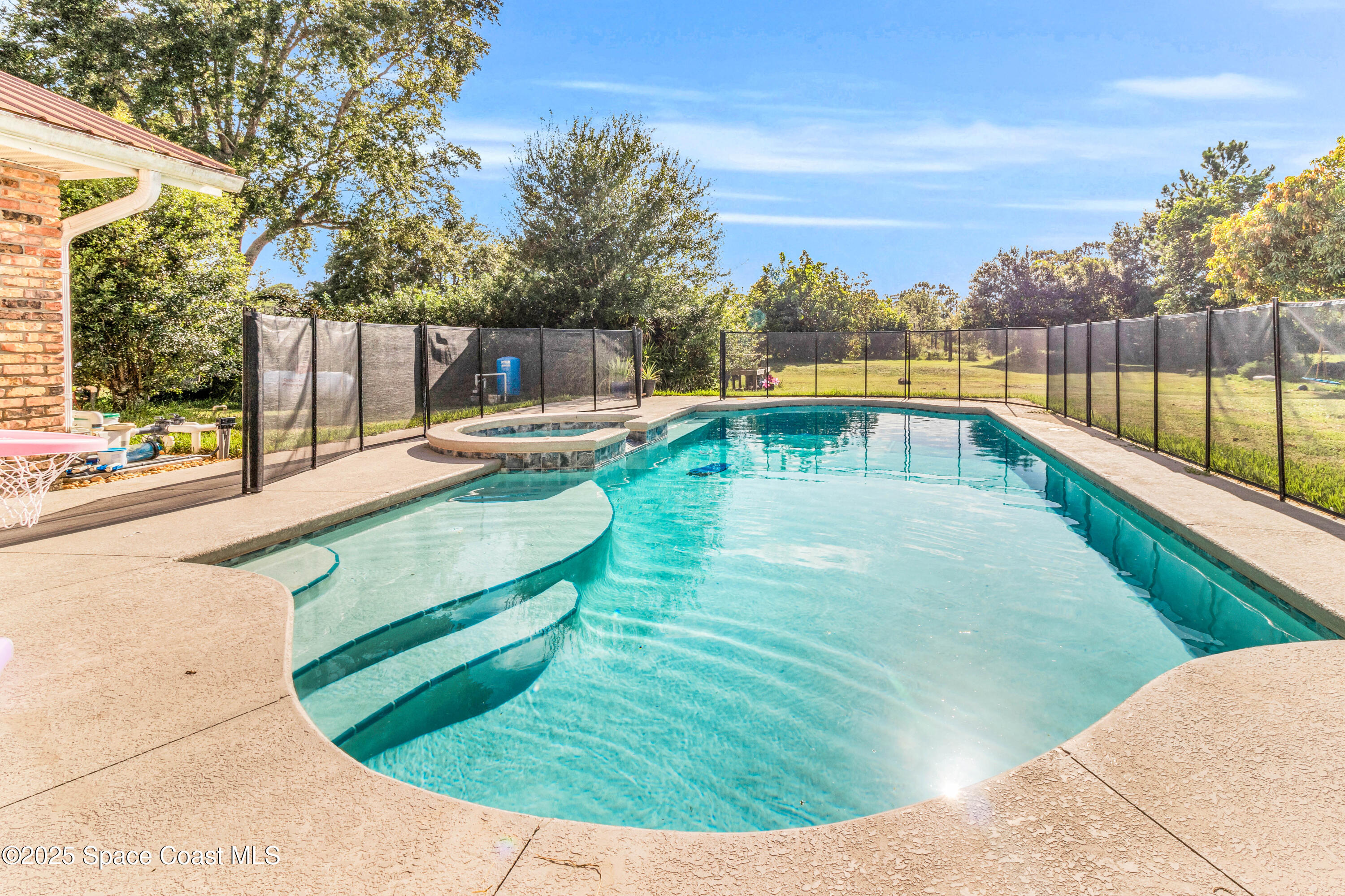 1980 Corey Road Malabar, FL 32950 - Photo 41 of 42 a view of a swimming pool with a patio