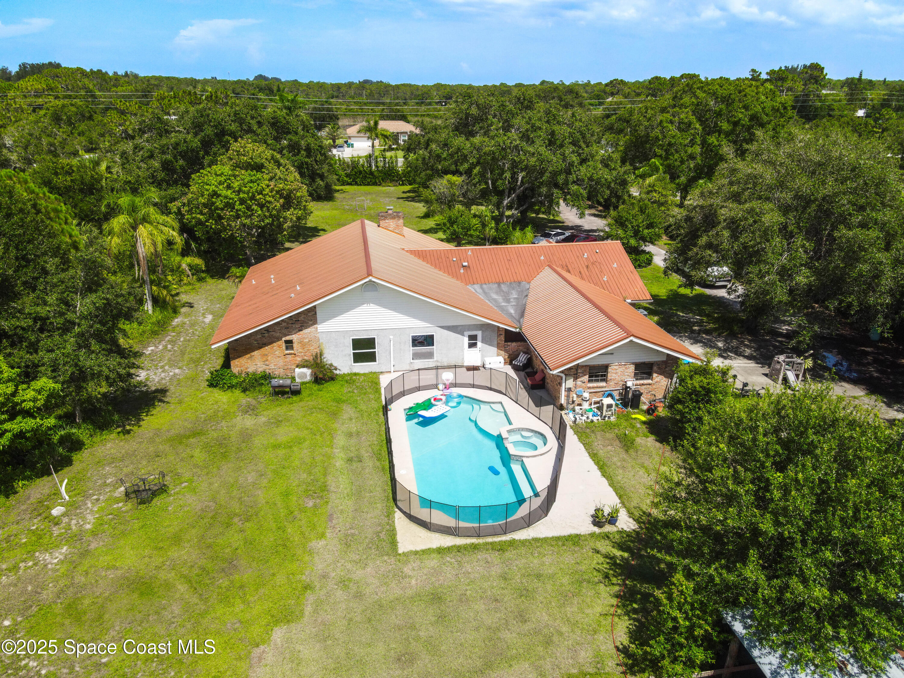 1980 Corey Road Malabar, FL 32950 - Photo 6 of 42 an aerial view of a house