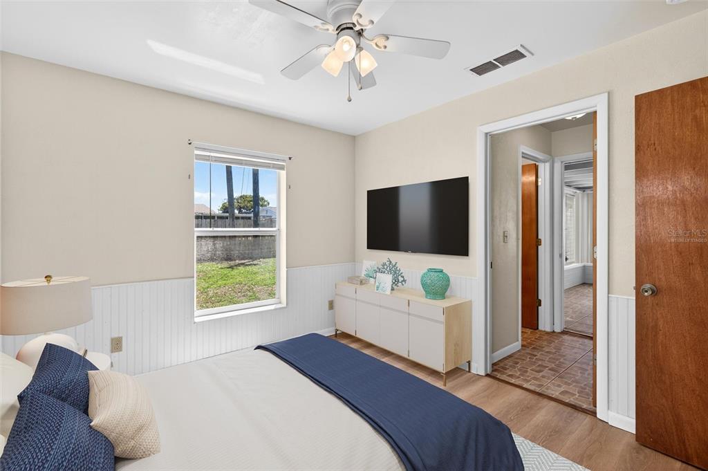 47 Carol Road Ormond Beach, FL 32176 - Photo 16 of 54 a bedroom with a bed and a flat screen tv