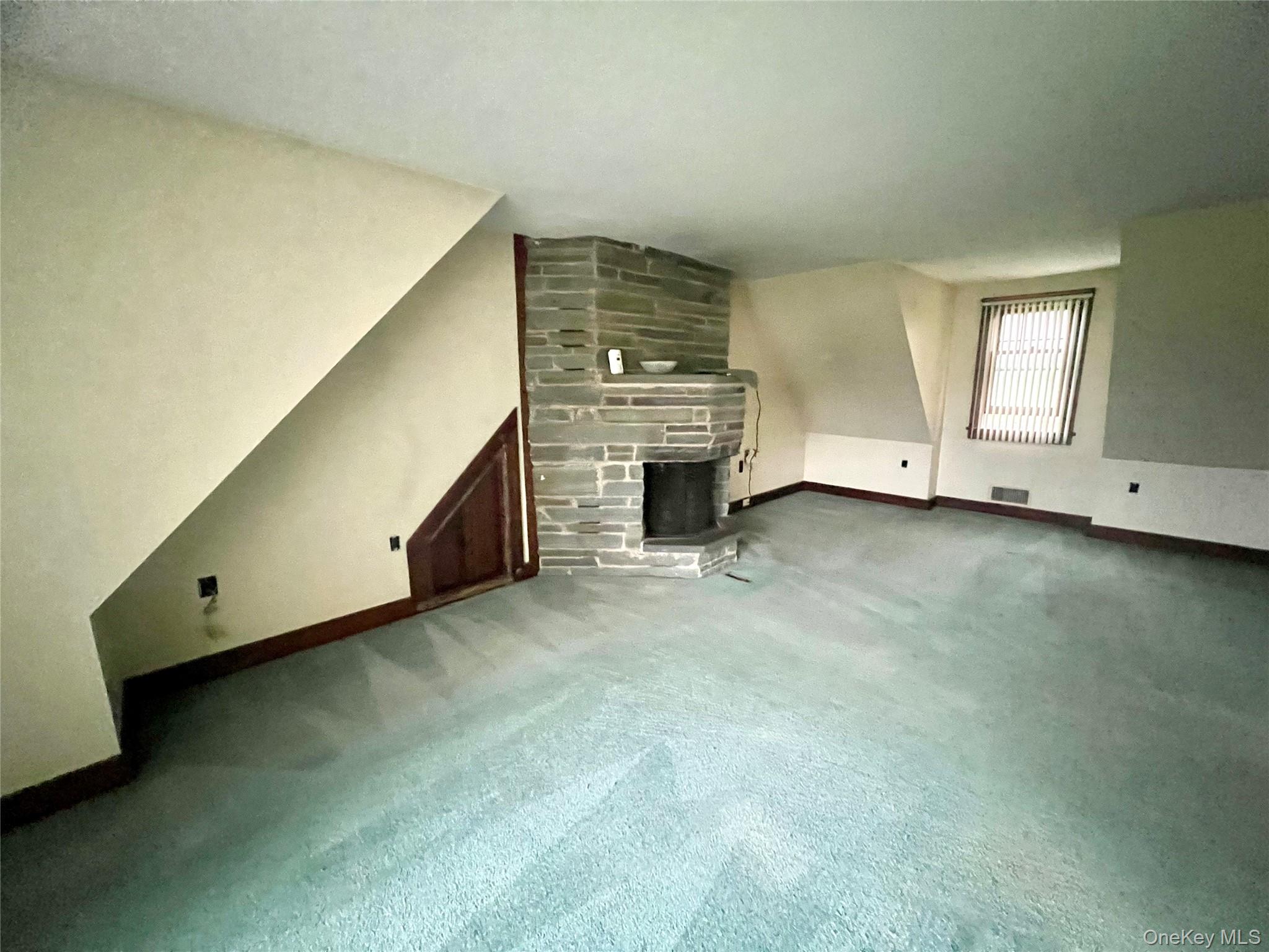 57 Hubbard Road Middletown, NY 10940 - Photo 14 of 30 a view of an empty room with a fireplace