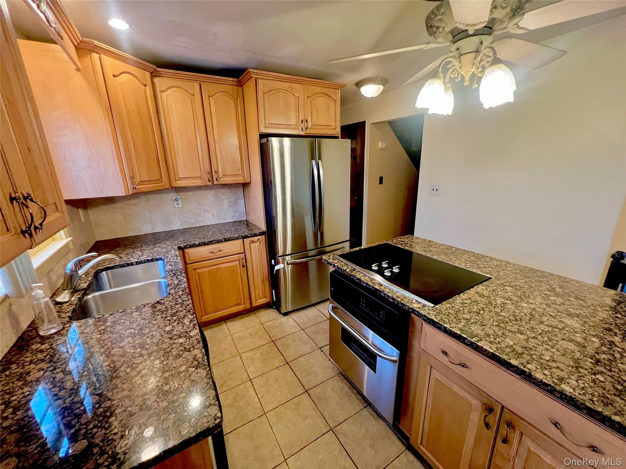 57 Hubbard Road Middletown, NY 10940 - Photo 9 of 30 a kitchen with stainless steel appliances granite countertop a sink stove and refrigerator