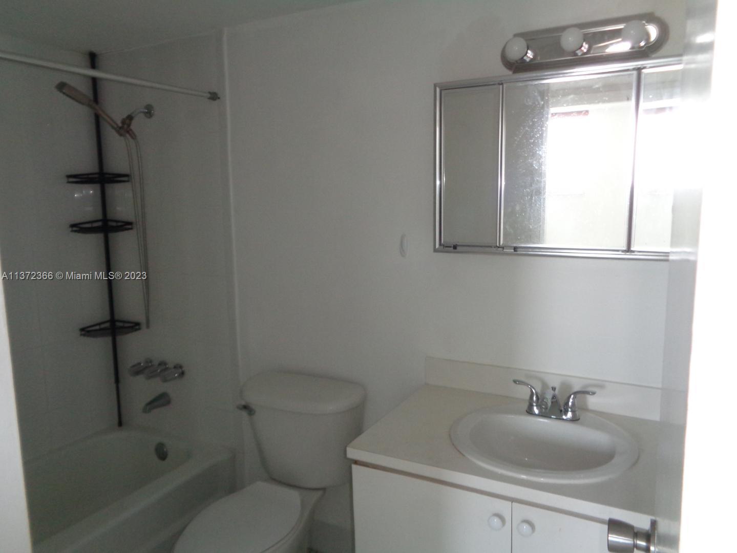 Allapattah Miami, FL 33142 - Photo 11 of 46 a bathroom with a sink toilet and shower