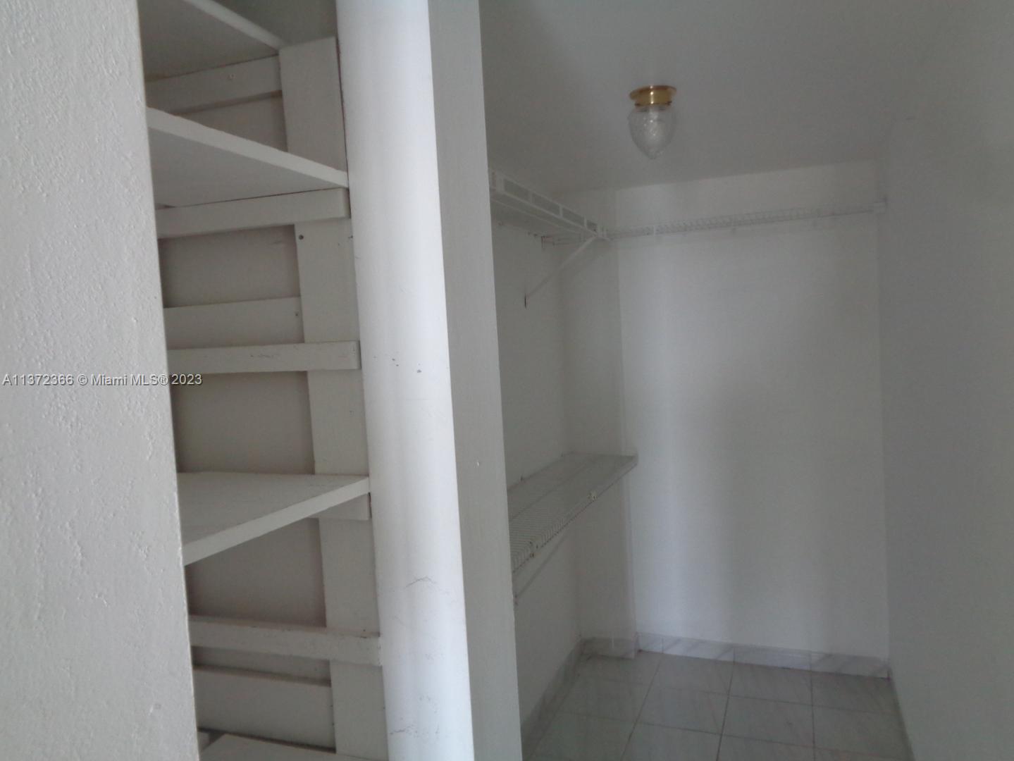 Allapattah Miami, FL 33142 - Photo 17 of 46 a view of an empty walk in closet