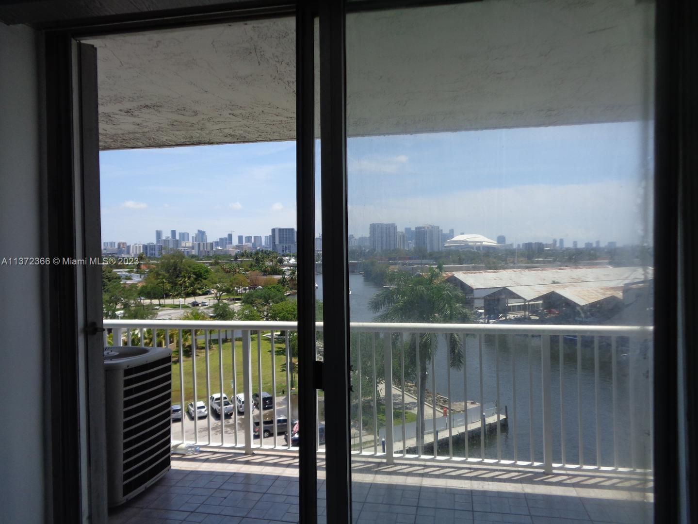 Allapattah Miami, FL 33142 - Photo 9 of 46 a view of a glass door with a balcony from a window