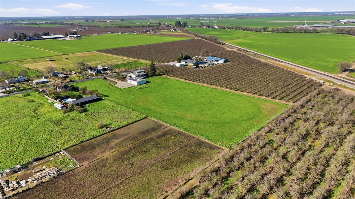 16166 Lawrence Road Escalon, CA 95320 - Photo 45 of 56 an aerial view of a house with a garden