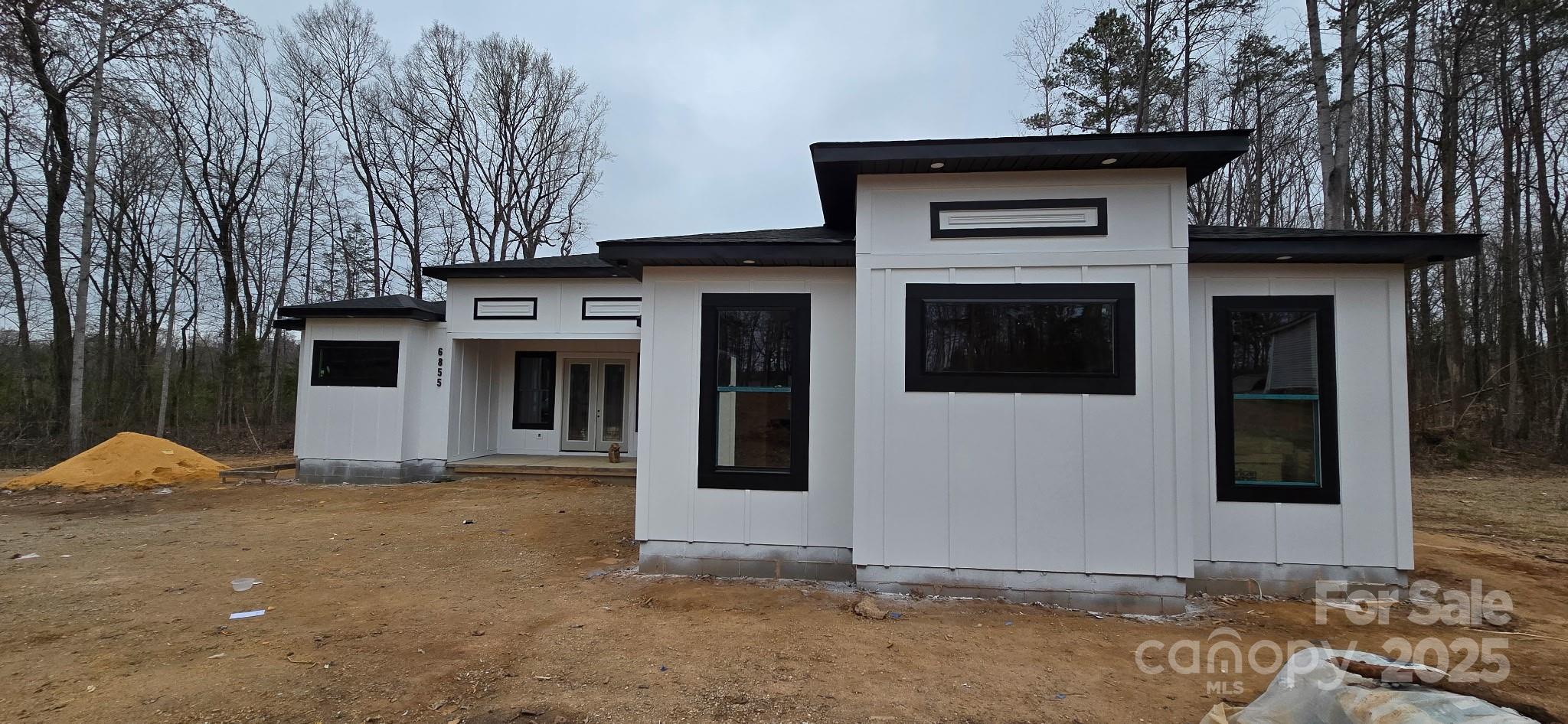 6855 Union Road Gastonia, NC 28056 - Photo 2 of 16 a house with trees in the background