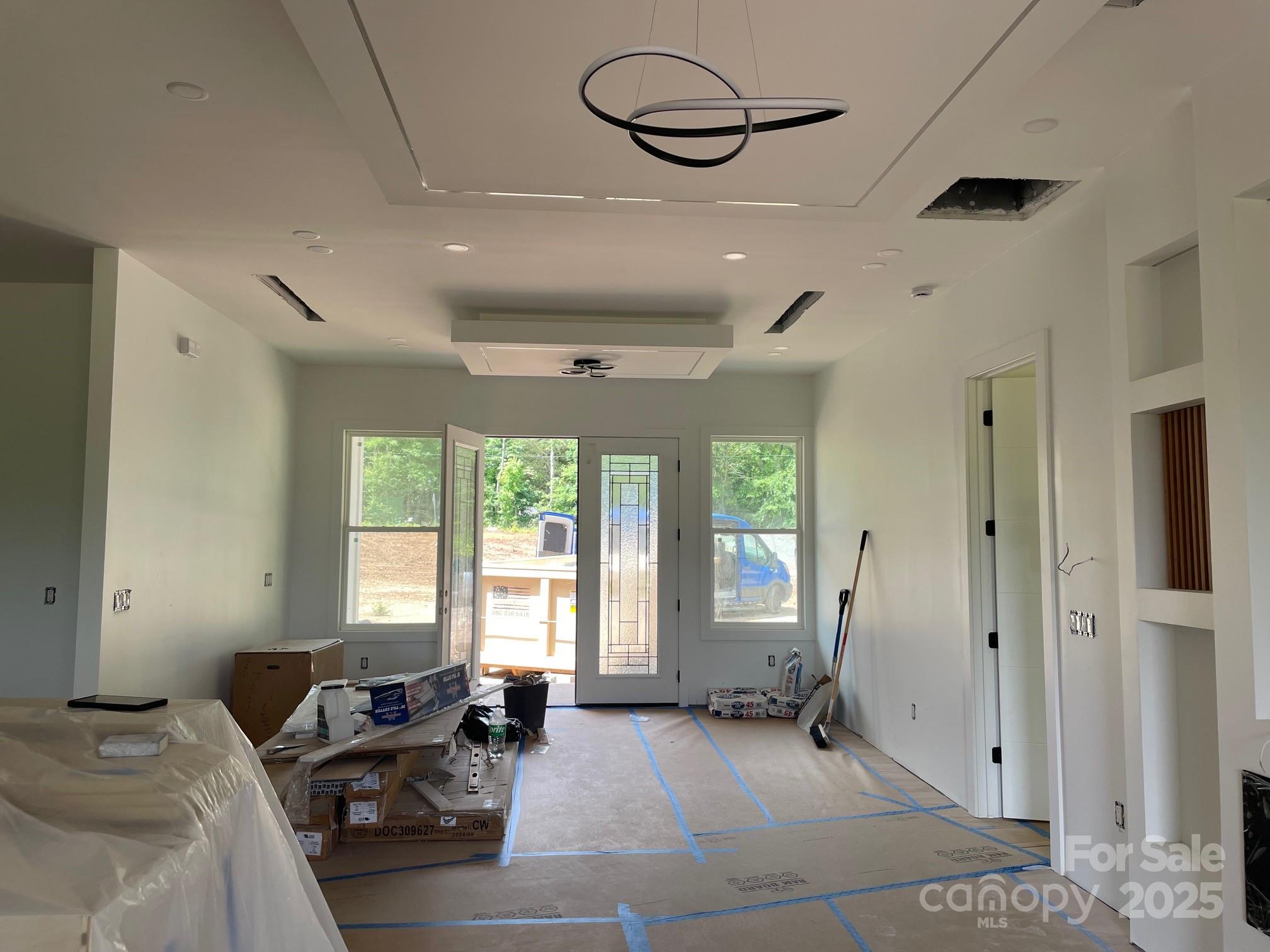 6855 Union Road Gastonia, NC 28056 - Photo 6 of 16 a spacious bedroom with a bed a couch and large window