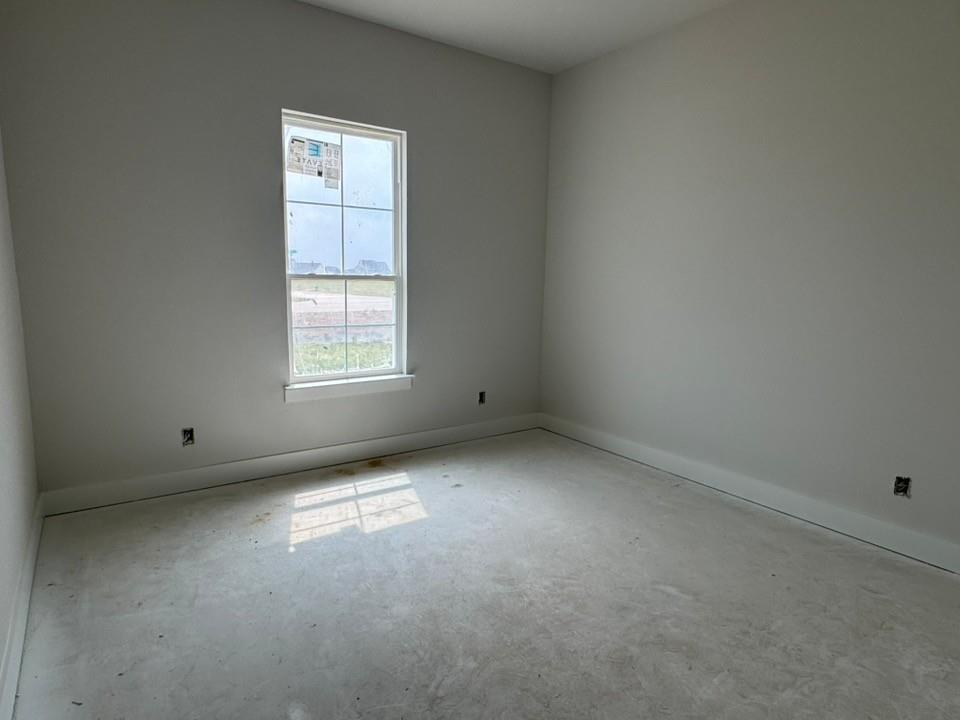 2305 Quartz Street Krum, TX 76249 - Photo 15 of 18 an empty room with a window