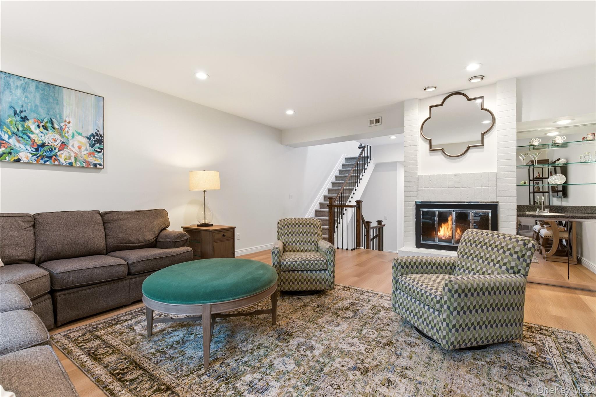 44 Hidden Ridge Drive Syosset, NY 11791 - Photo 3 of 28 a living room with furniture and a fireplace