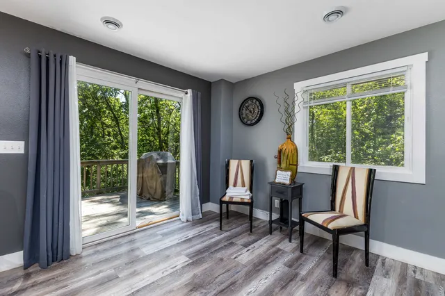 a view of a livingroom with furniture and a window