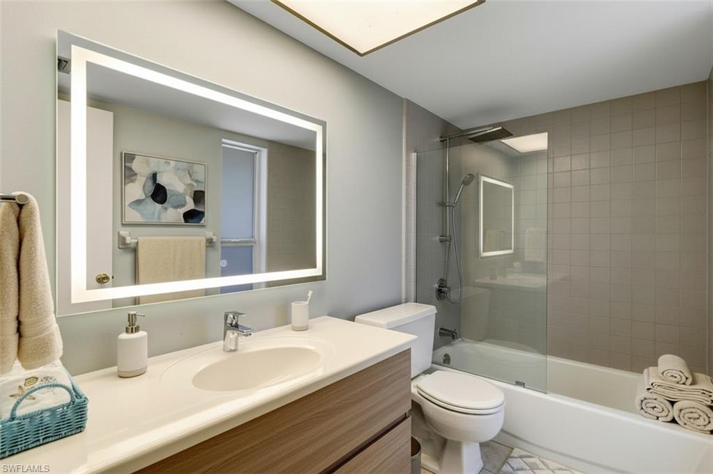 355 Palm Drive, Unit 732 Naples, FL 34112 - Photo 28 of 50 Bathroom- virtual staged- with vanity and shower / bathtub combination