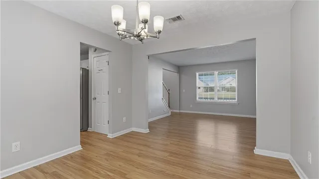 a view of livingroom with hardwood floor and hallway