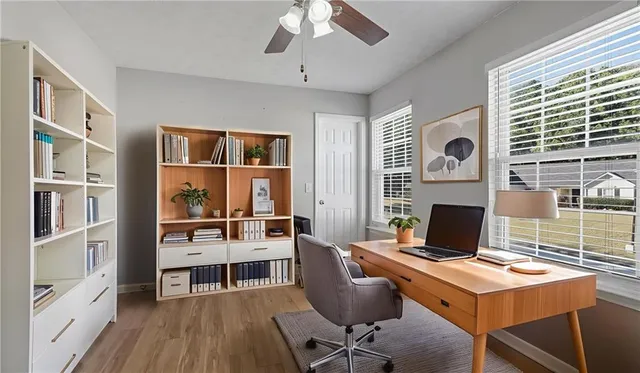 a workspace with furniture and window