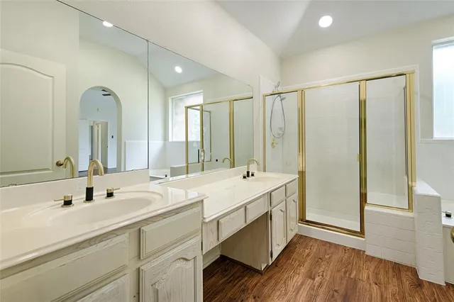 a bathroom with a double vanity sink mirror and double