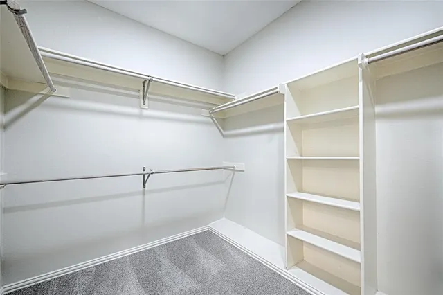 a view of an empty walk in closet