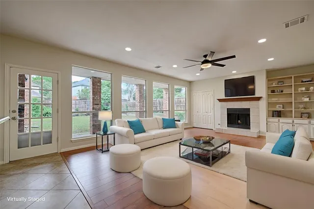 a living room with furniture and a fireplace