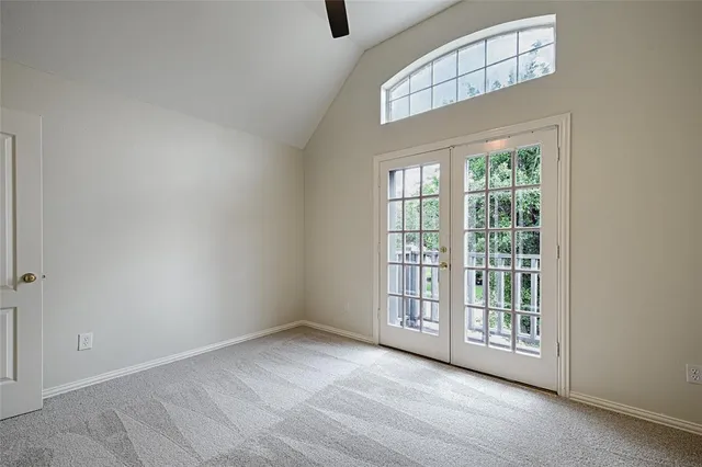 a front view of a house with a garden and plants