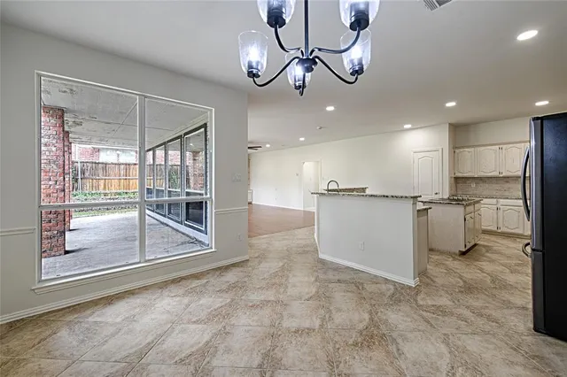 a view of a kitchen with a sink and cabinets