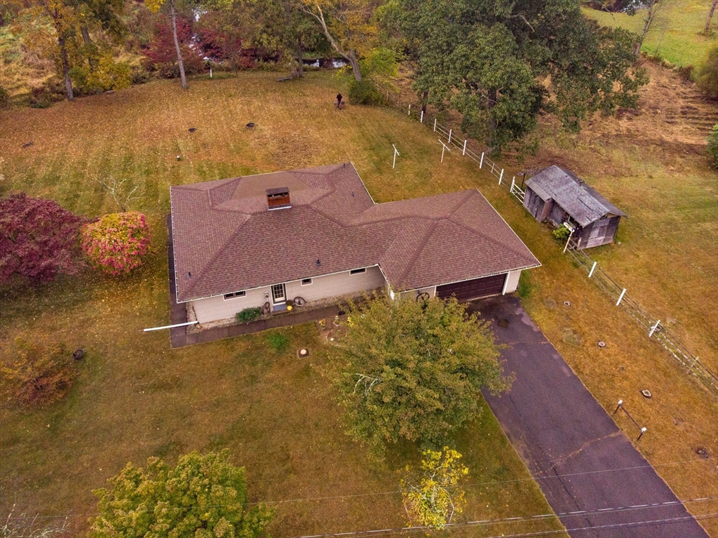 an aerial view of residential houses with outdoor space