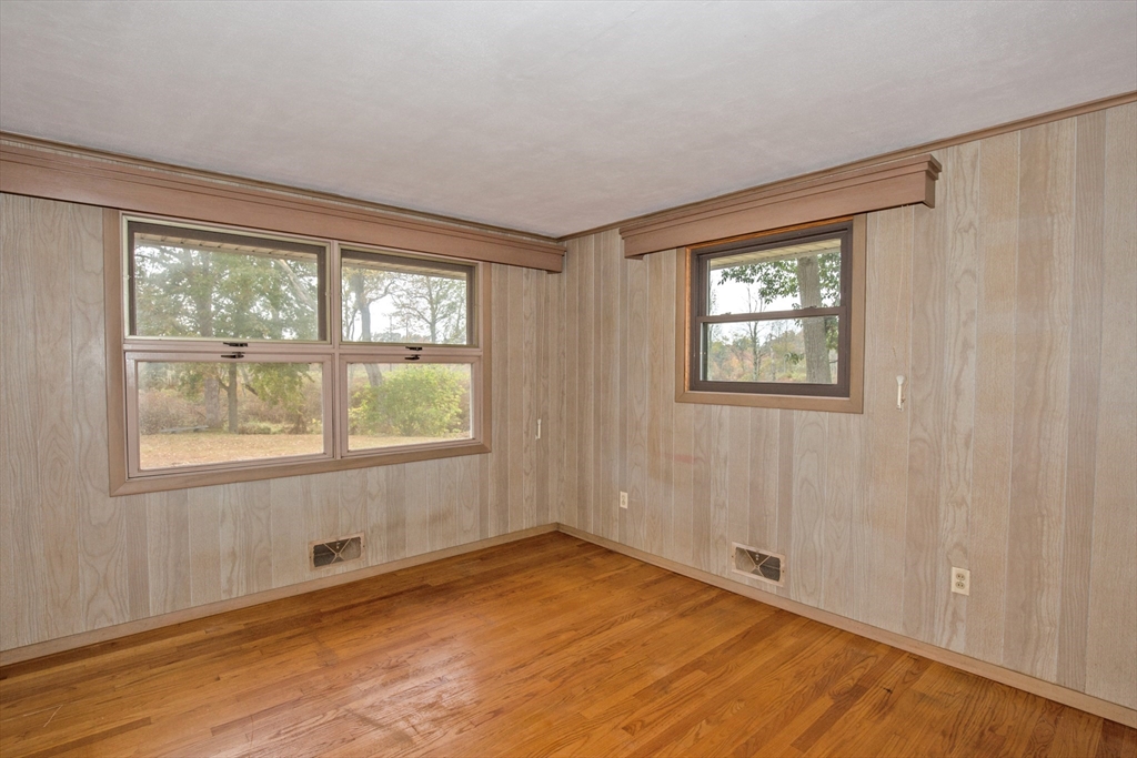 104 D Four Bridges Road Somers, CT 06071 - Photo 19 of 40 an empty room with wooden floor and windows