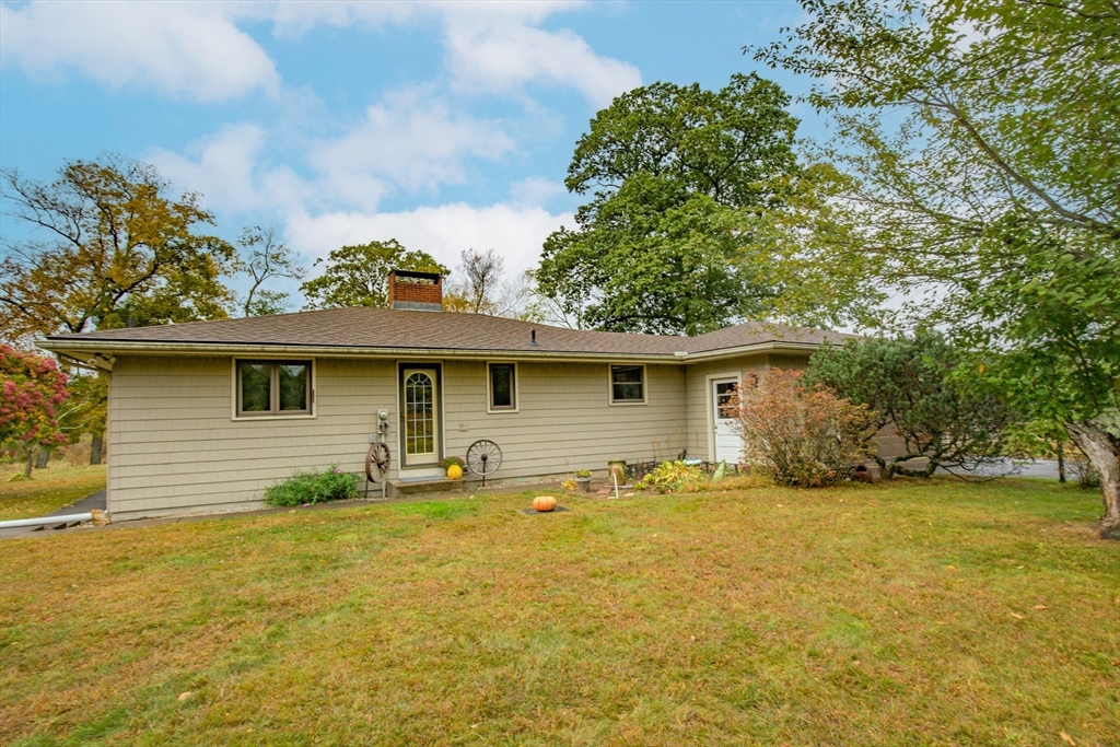 104 D Four Bridges Road Somers, CT 06071 - Photo 3 of 40 a view of a house with a yard