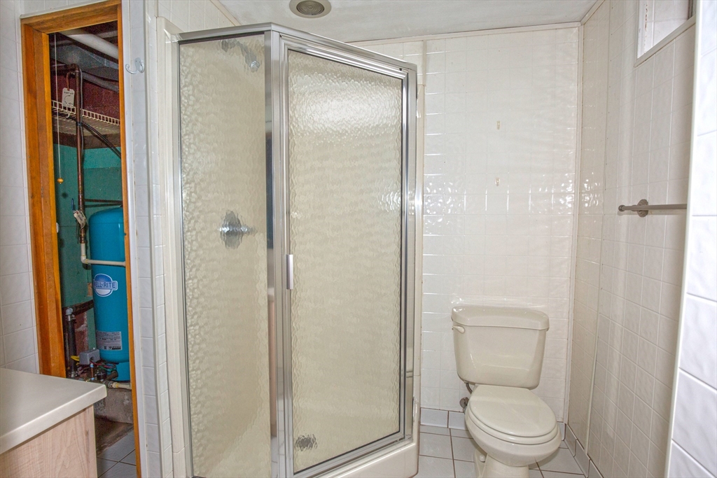 104 D Four Bridges Road Somers, CT 06071 - Photo 33 of 40 a bathroom with a shower a toilet and a sink