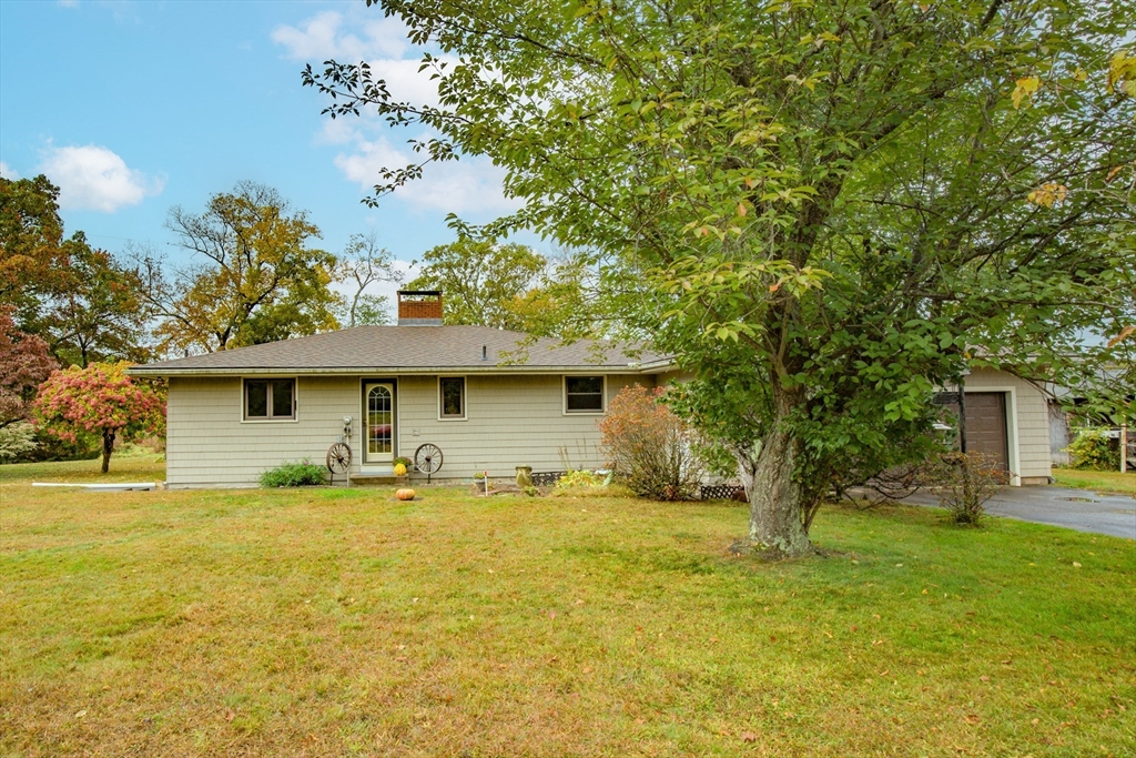 104 D Four Bridges Road Somers, CT 06071 - Photo 4 of 40 a front view of a house with yard and trees