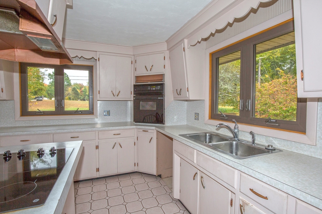 104 D Four Bridges Road Somers, CT 06071 - Photo 7 of 40 a kitchen that has a sink and a stove