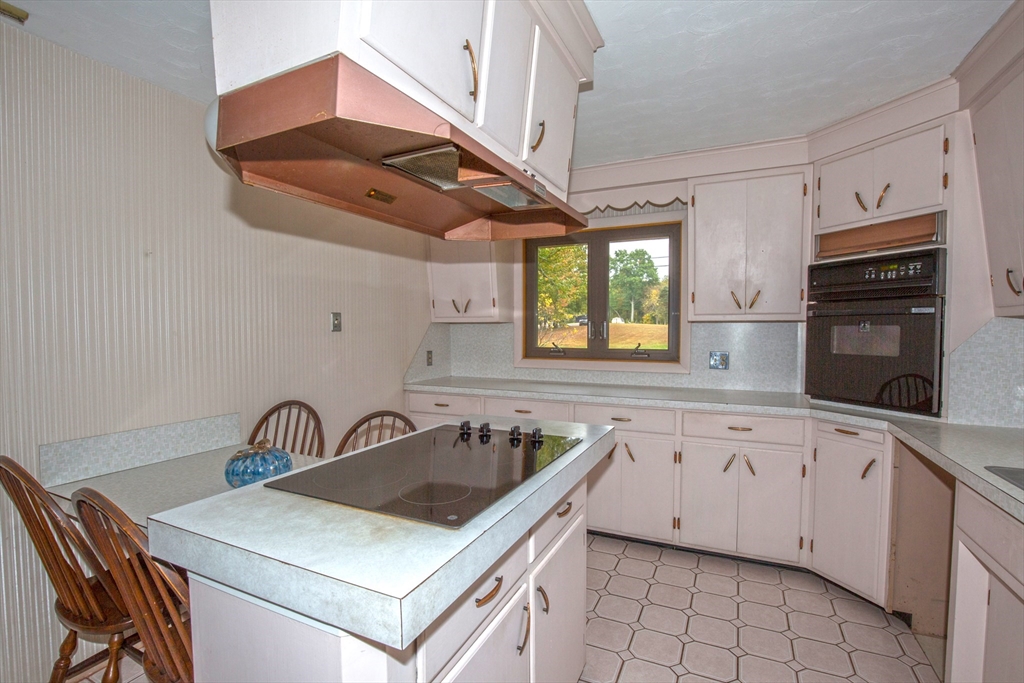 104 D Four Bridges Road Somers, CT 06071 - Photo 8 of 40 a kitchen that has a sink a stove and window